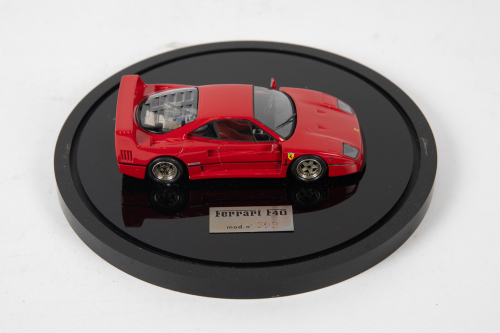 F40: A 1:43 scale model by BBR of a Ferrari F40, mounted to base, within perspex domed case