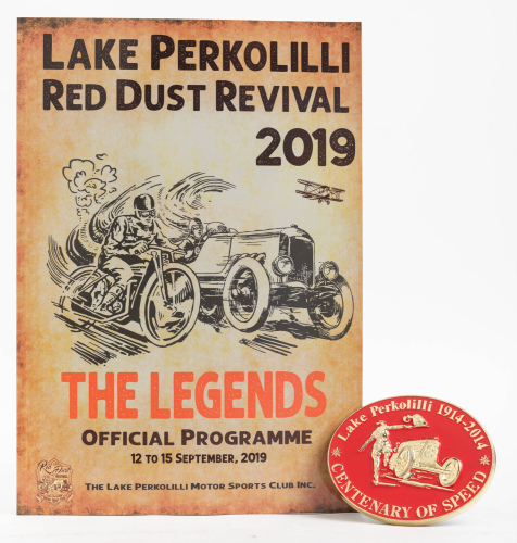 PERKOLILLI: Two items related to motoring at Lake Perkolilli Western Australia, including Centenary of Speed 1914-2014 grille badge, and a 2019 Red Dust Revival programme