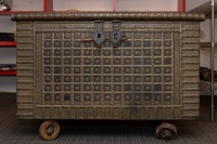 WEDDING CHEST: A large impressive antique metal bound Indian wedding chest on wheels [Location: City Beach, Perth]