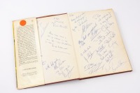 MEN AT THE WHEEL: A hardcover book by Peter Miller published by B. T. Batsford Ltd, inscribed and signed by various motor racing drivers and personalities including World Champions Graham Hill, Jack Brabham, Phil Hill and many others [Location: Perth] - 2