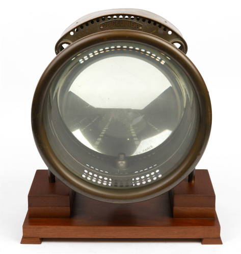 HEADLIGHT: A large Ducellier (France) brass headlamp, lens with 26.5cm (10.5 inches), stamped 'depose 1131 6658A' at top, mounting bracket width 27.5cm, height approx 34cm