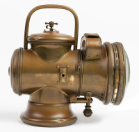 HEADLIGHT: A circa early 1900s Herm Riemann (Germany) brass headlight, convex lens width 18cm (7 inches), vertical bail handle, overall height 34cm [Location: Melbourne] - 5