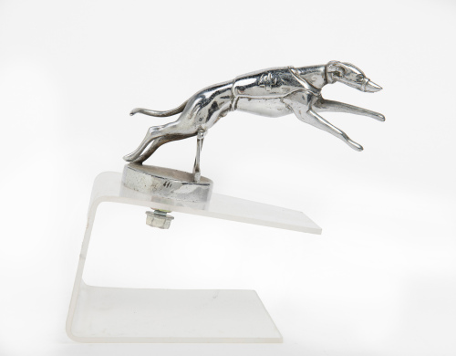 MASCOT: An Art deco style chrome 'racing greyhound' car mascot, 15cm long, affixed to perspex base
