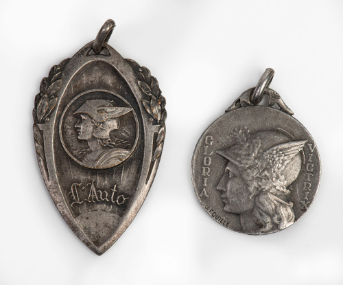 L'AUTO: Two fine circa 1920s L'AUTO pendants featuring Mercury, one stamped by French sculptor maker 'J.F. Quille'