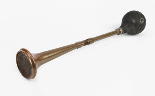 HORN: A long Desmo (UK) brass horn, number '10' marked on bulb, fly mesh to bell end, overall length 54cm
