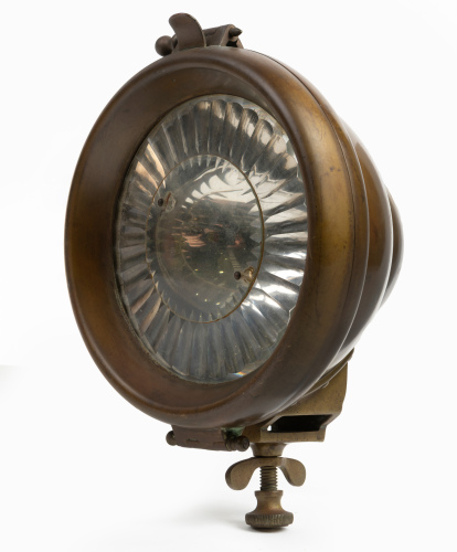 HEADLAMP: A c1910s small Worsnop & Co brass headlamp, stamped 'RD541958', with reeded prism lens, width 12cm