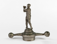 MASCOT: A male golf player car mascot on 'dog-bone' radiator cap, overall height 16cm, width 18cm [Location: Melbourne]