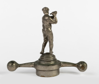 MASCOT: A male golf player car mascot on 'dog-bone' radiator cap, overall height 16cm, width 18cm [Location: Melbourne] - 2