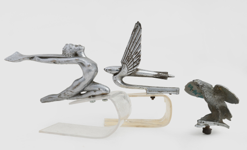 MASCOTS: Three chrome car mascots