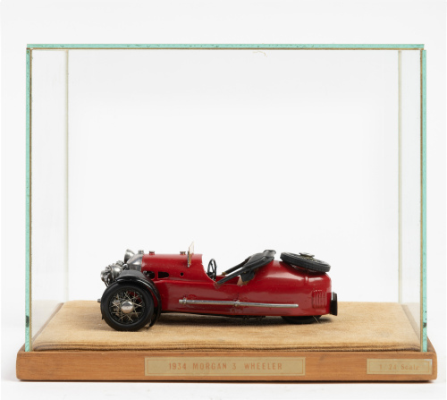 MORGAN: A 1934 Morgan three wheeler model, 13cm long, in glass display case