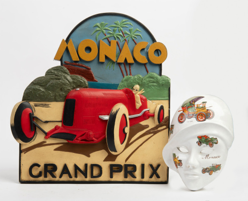 MONACO: Two decorative Monaco relating items, includes a ceramic wall mask featuring late 1800s and early 1900s cars and an embossed wall plaque, 38cm high, 35cm wide