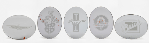 AMERICAN: A group of five serving dishes each featuring American car insignias