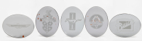 AMERICAN: A group of five serving dishes each featuring American car insignias [Location: Melbourne]