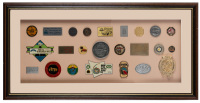 BADGE DISPLAY: A large badge display piece, includes mostly badges from Australian Rally & National meets plus a few international badges, 29cm high, 74cm wide [Location: Melbourne]