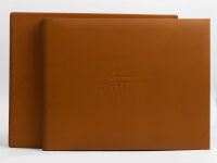 ROLLS-ROYCE: 'The Spirit - Celebrating 75 Years of the Rolls-Royce Motor Car' by Ken Dallison, oversized leatherbound hardcover book in slipcase, limited edition (82/2000), signed by artist Ken Dallison [Location: Melbourne]