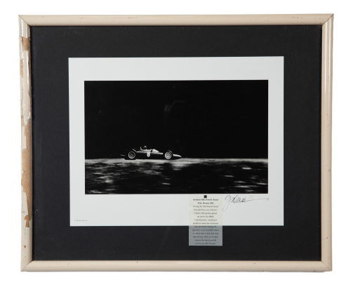 B.R.M: A print featuring a b/w photograph of c1962 Graham Hill driving B.R.M at French Grand Prix, signed by the photographer, image 19cm high, 31cm wide