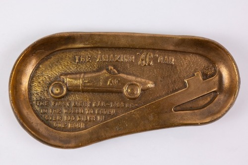 AC: A brass tray commemorating the achievement of the AC car, which became the first 1500cc light car in history to cover 100 miles in one hour at Brooklands [Location: Perth]