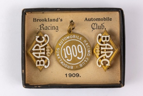 BROOKLANDS: A set of three 1909 Brooklands BARC lapel badges [Location: Perth]