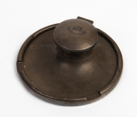 INKWELL: A brass inkwell deskware piece with inscription 'Ne Obliviscaris' below Campbell Clan 'boar's head' crest on lid, 20cm diameter, 8cm high [Location: Melbourne]