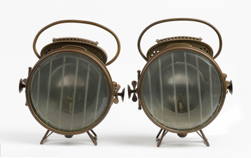 HEADLIGHTS: A pair of c1900s Hermann Riemann brass headlights, lined lens 16.5cm wide, overall height 29cm