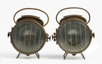 HEADLIGHTS: A pair of c1900s Hermann Riemann brass headlights, lined lens 16.5cm wide, overall height 29cm [Location: Melbourne]