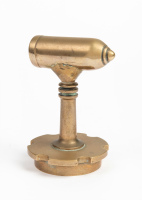 MASCOT: A brass mascot in the form of a bullet affixed to radiator cap, 10cm high, 6.5cm wide [Location: Melbourne]