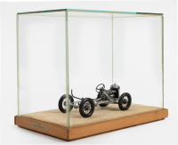AUSTIN: An Austin Seven rolling chassis model, 10.5cm long, in glass display case [Location: Melbourne] - 2