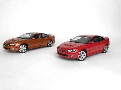 PONTIAC: Pair of 1:18 scale Pontiac GTO cars produced by GMP. (NB description)