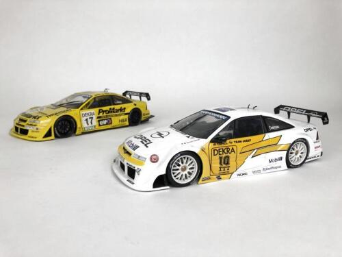 OPEL: Pair of 1:18 scale Opel Calibra racing cars produced by UT. (NB description)