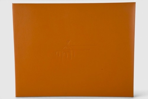 ROLLS-ROYCE: 'The Spirit - Celebrating 75 Years of the Rolls-Royce Motor Car' by Ken Dallison, large format leatherbound hardcover book, limited edition (1672/2000), signed by artist Ken Dallison [Location: Melbourne]