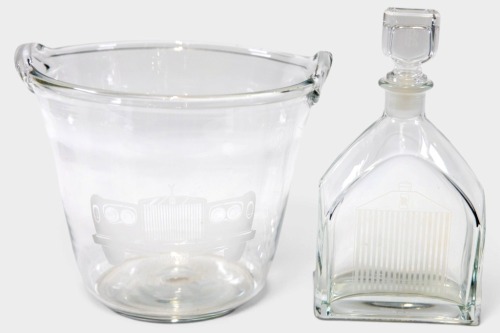 CRYSTAL WARE: Two items of crystal wear including an ice bucket by Tiffany and Co with an etched front of a Rolls-Royce with a license plate marked 'XMAS 75', along with a decanter with etched Rolls-Royce grille [Location: Melbourne]