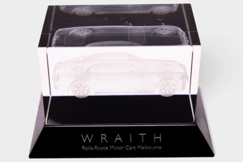 WRAITH: A Rolls-Royce Motor Cars Melbourne dealership crystal deskpiece featuring the Rolls-Royce Wraith Coupe, 12.5cm long, 8cm wide, 8cm high [Location: Melbourne]