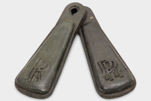 ROLLS-ROYCE: Two Rolls-Royce black rubber teardrop-shaped key ring fobs, each measuring approx 6.5cm high [Location: Melbourne]