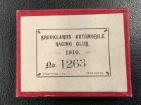 BROOKLANDS: A set of three 1910 Brooklands BARC membership lapel badges and medallion, No. 1263 [Location: Perth] - 2