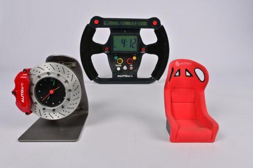 CLOCKS: Group of time pieces and miscellaneous car part models produced by AutoArt. (NB description)
