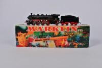 MARKLIN-HAMO: A circa 1970s Marklin-Hamo two rail 8393 4-6-2 steam outline locomotive and bogie tender, boxed