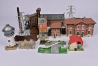 TRACK SIDE BUILDINGS: A box of approx. a dozen track side buildings and accessories.