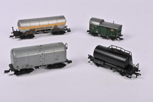 FLEISCHMANN: Four Fleischmann rolling stock, three tank wagons and a brake van, all unboxed