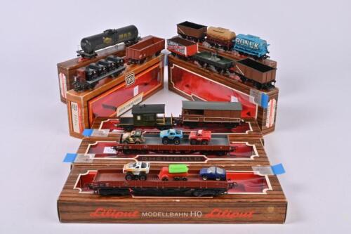 A collection of thirteen bogie and four wheel rolling stock, including Rivarossi, Mainline etc. in associated Liliput boxes