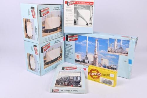WALTHERS: Six boxed Walthers Cornerstone Series lineside oil refinery and storage tank buildings, and a boxed G.W.R.&nbsp;brake van kit, NIB