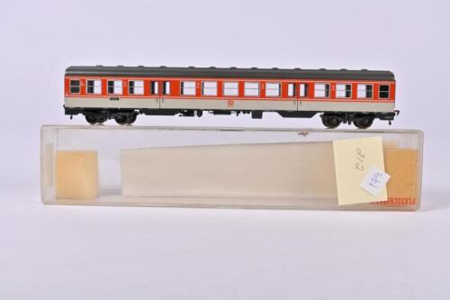 FLEISCHMANN: A Fleischmann orange/silver second class coach, one coupling loose