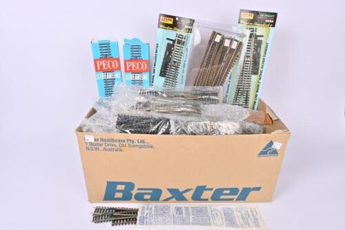 A large box of Peco, Roco, Atlas HO/OO track points, crossovers etc.