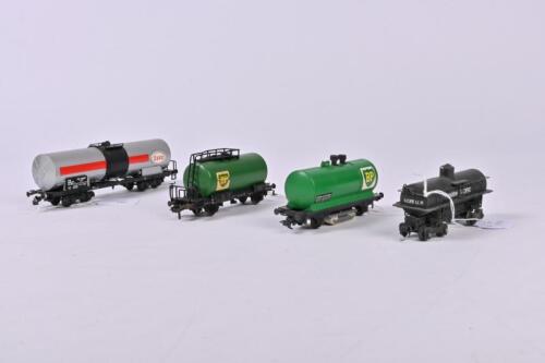 VARIOUS: Four tank wagons, one Esso, one Union Pacific and two BP (including one track cleaning tank wagon) all unboxed