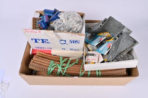 SPARE PARTS: A large quantity of HO/OO spares including Pico point motors, Marklin and Tri-ang switches, track, paint, rail bridge and trestle elevation set, batteries and many others too numerous to mention