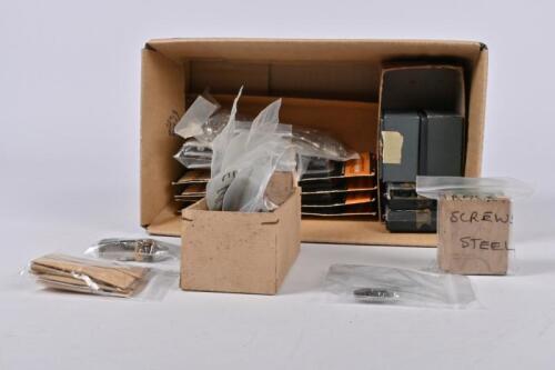 SPARE PARTS: A collection of HO guage spare parts incuding trucks, fuses, screws and shoes