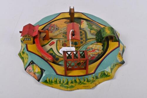 CLOCKWORK TOYS: A Japanese clockwork lithograph print Central Station train toy, circa 1950. Good working order.