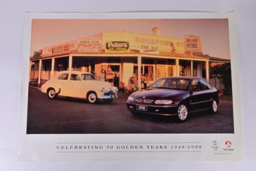 HOLDEN: A commemorative 'CELEBRATING 50 GOLDEN YEARS 1948 -1998' Holden poster depicting two Holden models in rural Australian setting