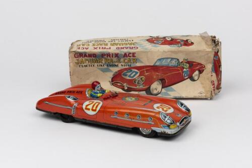 JAGUAR: A 1960s Japanese tin friction toy of a Jaguar race car with driver by Aoshin