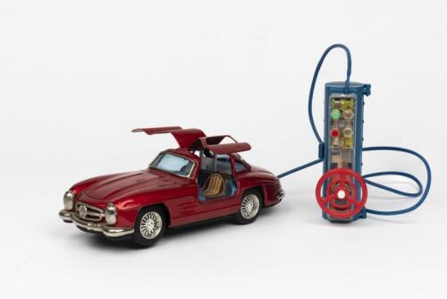 MERCEDES: A 1950s Japanese R/C battery operated tin toy of a Mercedes Benz Gullwing 300 SL 2-door coupe by Bandai