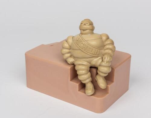 MICHELIN: A rare 1950s bakelite Bibendum coin bank, offered by Michelin to children of UK employees